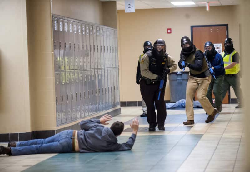 Simulating an active-killer emergency as part of the training.