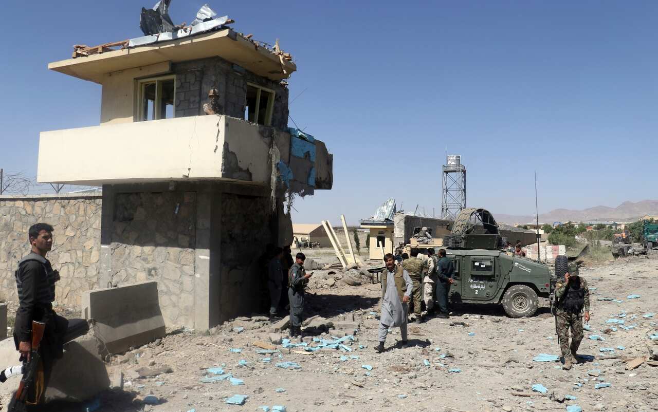 Security forces are deployed as the site of suicide attacks and an ongoing clash between Taliban insurgents and government forces (AAP)