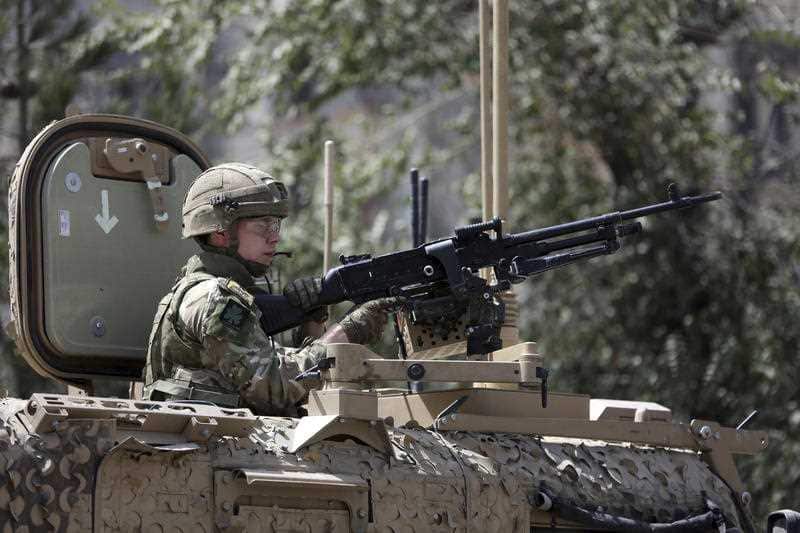 Resolute Support (RS) forces guard at the site of a car bomb explosion in Kabul, following the recent attack.