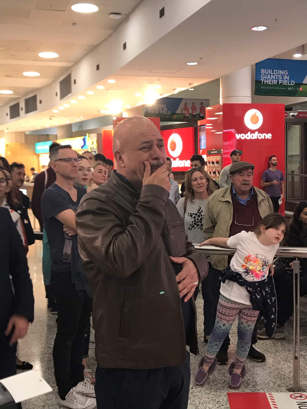 The Australian citizen's brother spies him for the first time in the airport terminal.
