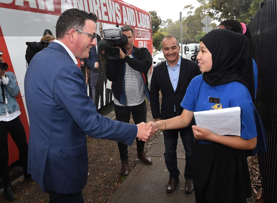 Victorian Premier Daniel Andrews (left) meets school captain Heba Nabizada at Cranbourne West Primary School in Melbourne, Friday, November 23, 2018. Victorians go to the polls on Saturday. (AAP Image/Julian Smith) NO ARCHIVING