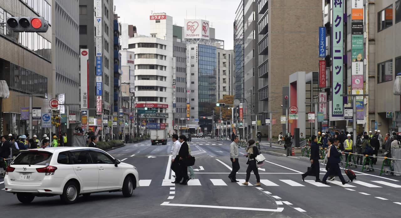 A road in front of JR Hakata station in the southwestern Japan city of Fukuoka reopens on Nov. 15, 2016. (AAP)