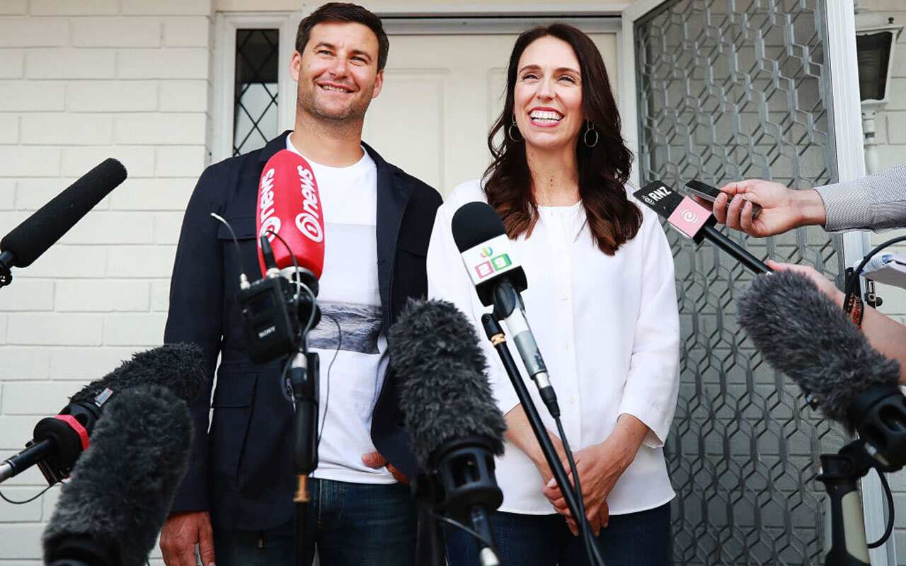 Prime Minister Jacinda Ardern and her partner Clarke Gayford speak to the media January 19, 2018 in Auckland
