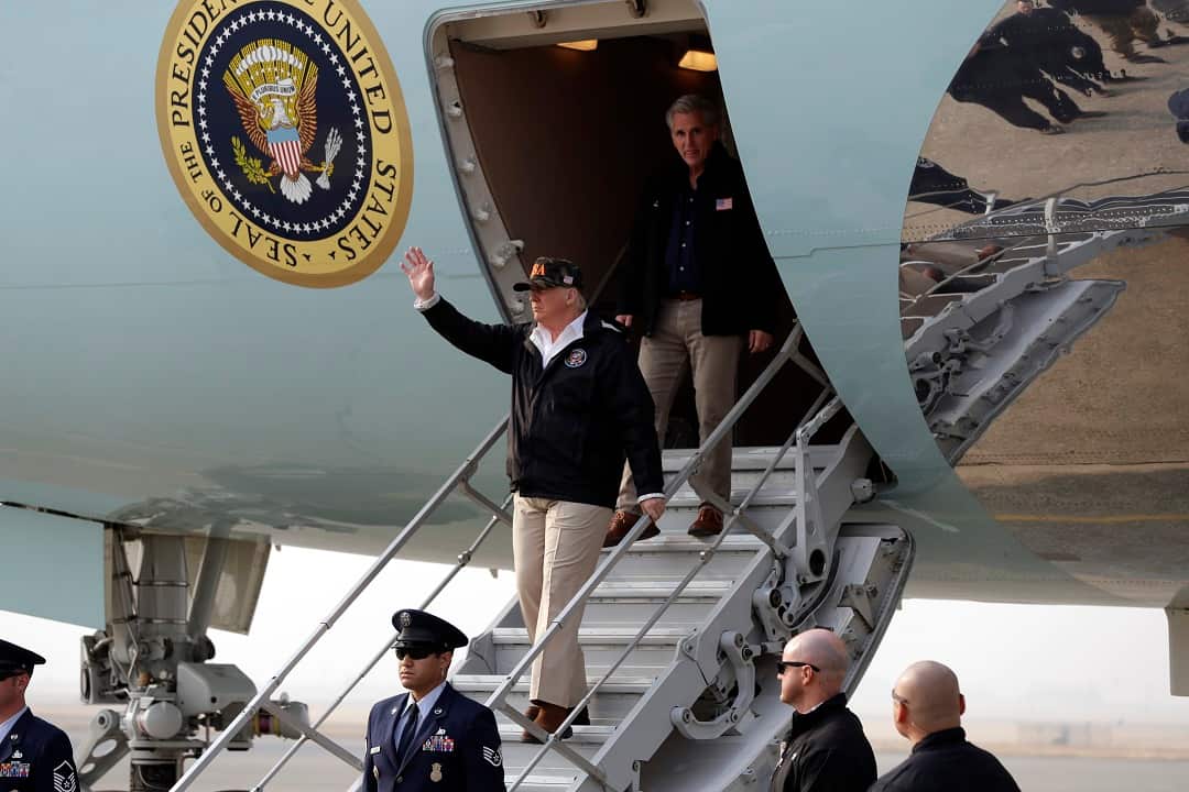 President Donald Trump arrives at Beale Air Force Base for a visit to areas impacted by the wildfires.