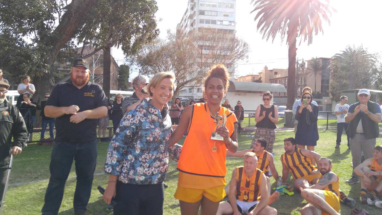 Kathleen Sailor receives Salvo Hawks award.