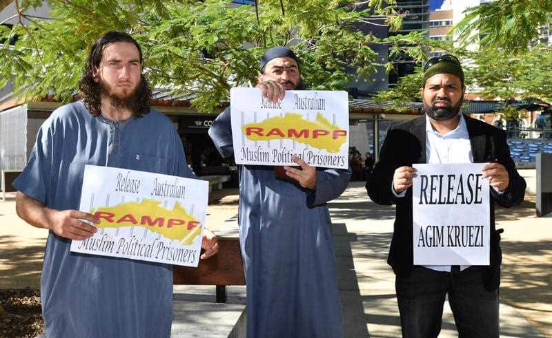 Supporters of Agim Kruezi are seen outside the Brisbane Supreme Court in Brisbane.