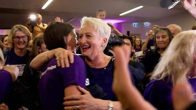 A victorious Kerry Phelps celebrates with supporters after her Wentworth by-election win.