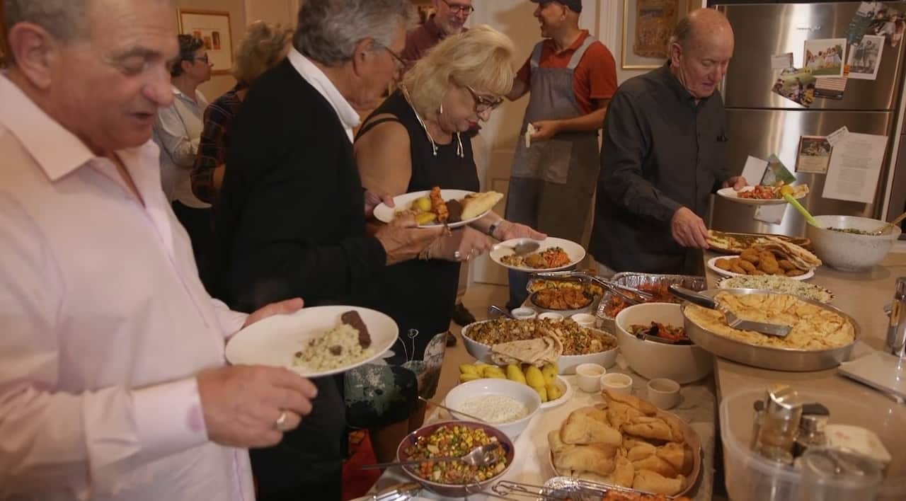 Guests tuck in to the Baghdad Soul Food buffet at Lea Bouganim's dinner party.