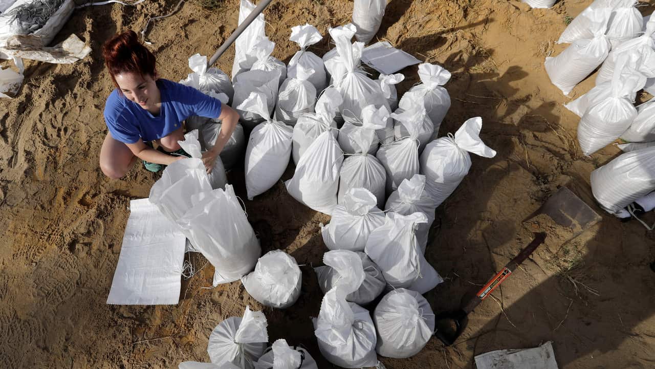 Ashley Boudreaux ties sandbags in Baton Rouge.