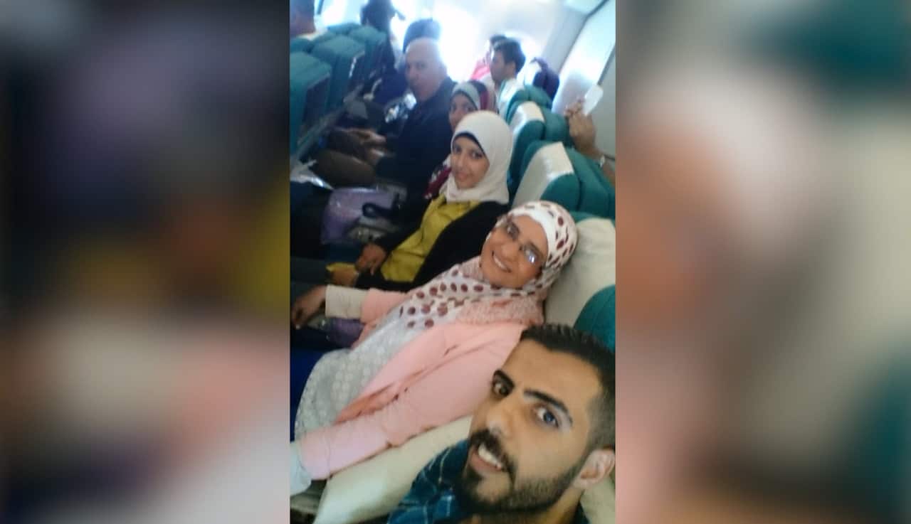 The Al-Janabi family on their way to Australia, with Matheel in the middle in yellow.