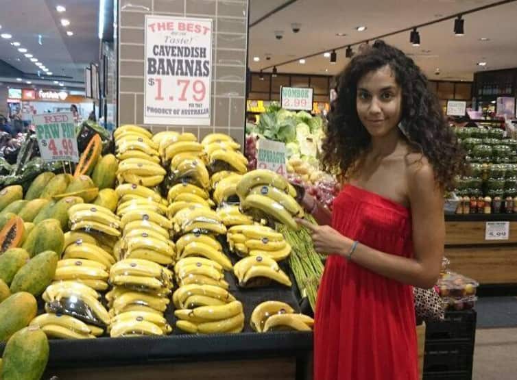 Bananas wrapped in single-use plastic packaging.