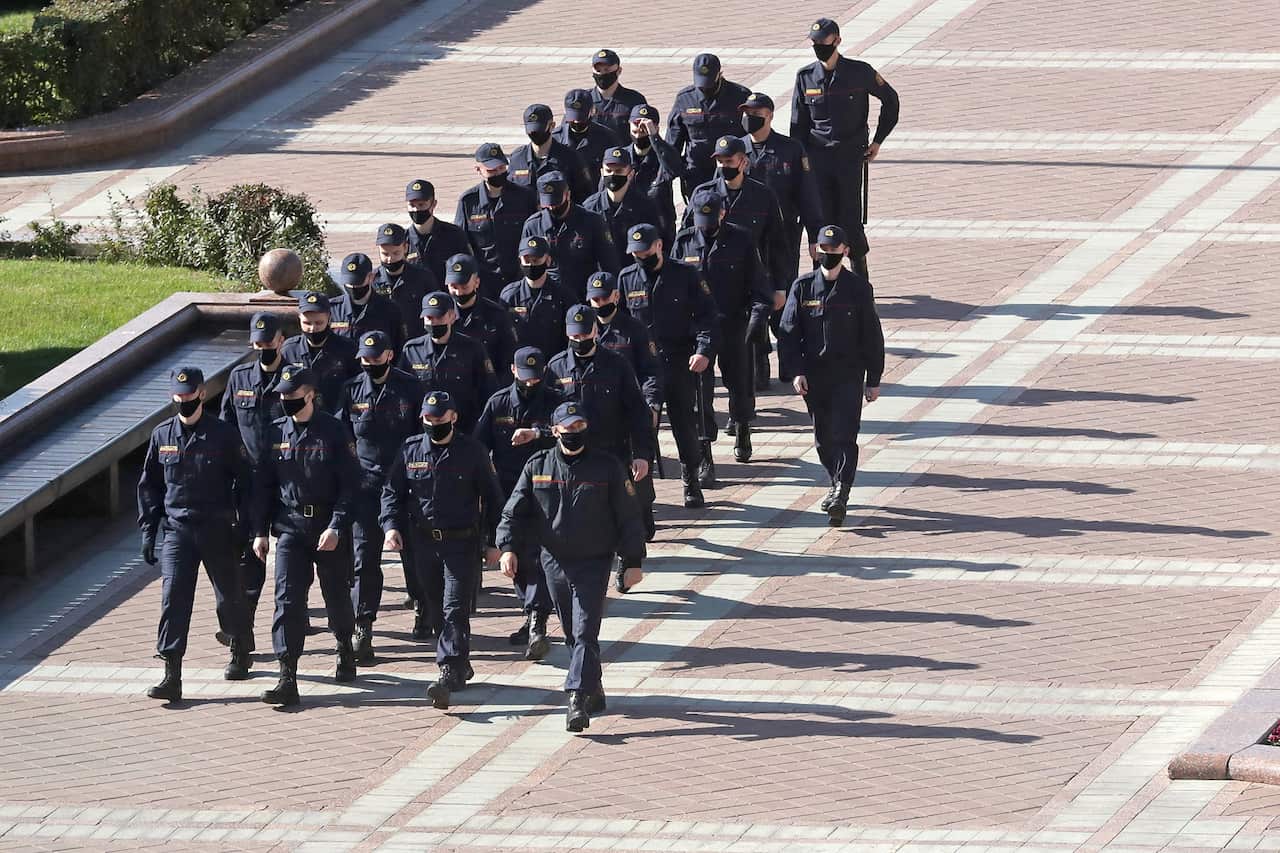 Police officers patrol the area near Independence Square.