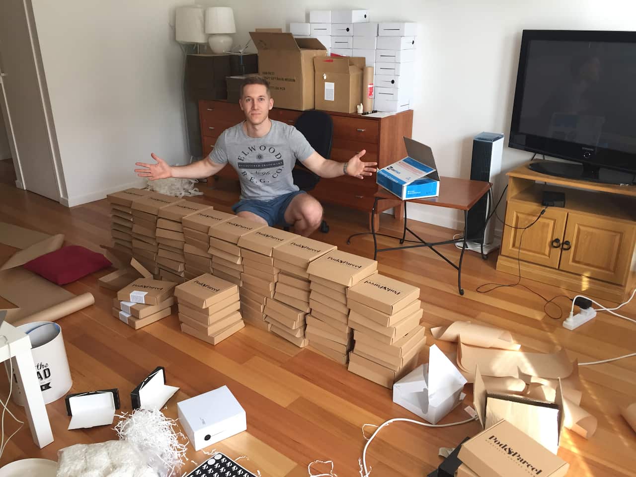 Ben Goodman in his living room packing Pod & Parcel orders. 