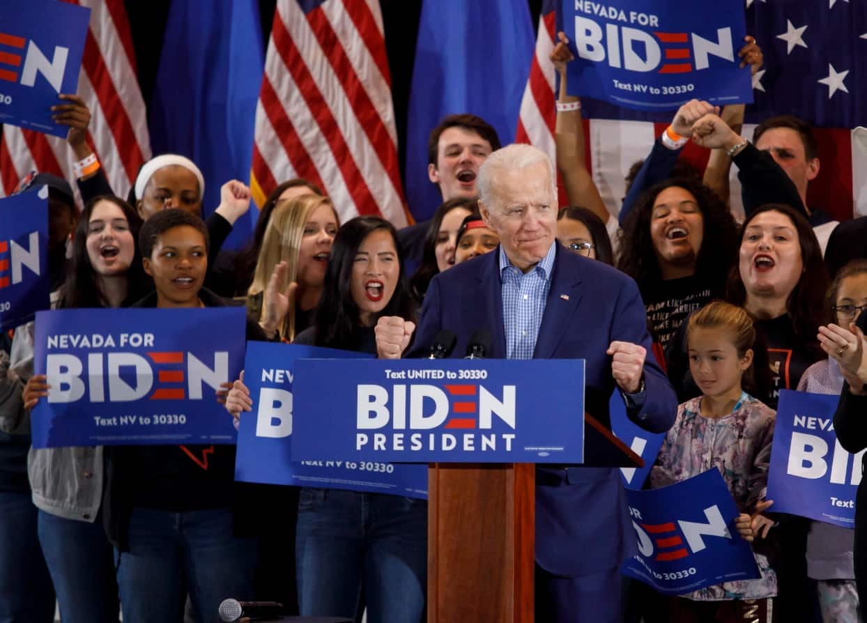 US Democratic presidential candidate, former Vice President Joe Biden (2-L), arrives on stage during his Nevada post-caucus rally in Las Vegas