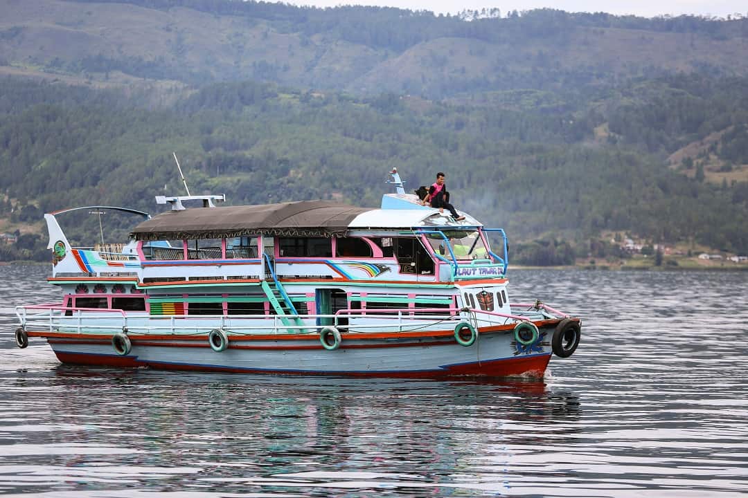 A boat similar to the KM Sinar Bangun, a ferry that capsized 18 June, travels on Lake Toba.