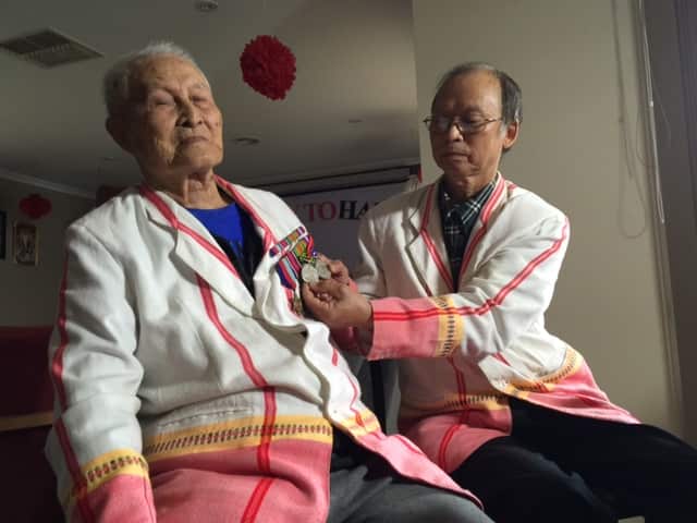 Bordy Weeku (left) and his son Et Too Saw (right) (SBS)