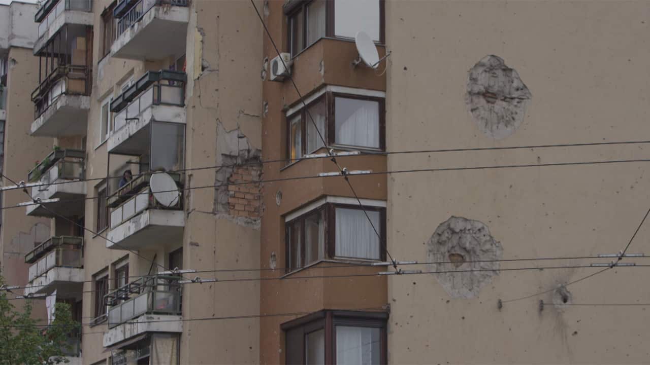 The scars of the war can still be seen on buildings in Bosnia.