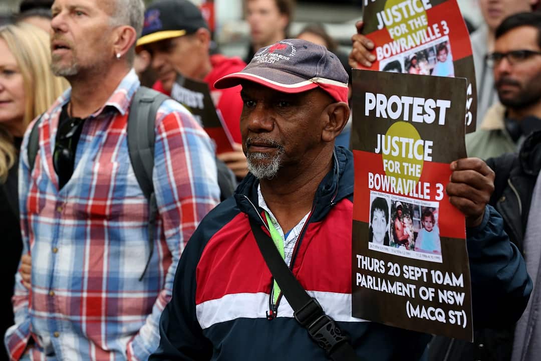 Protesters want a man go to trial for murdering three children.