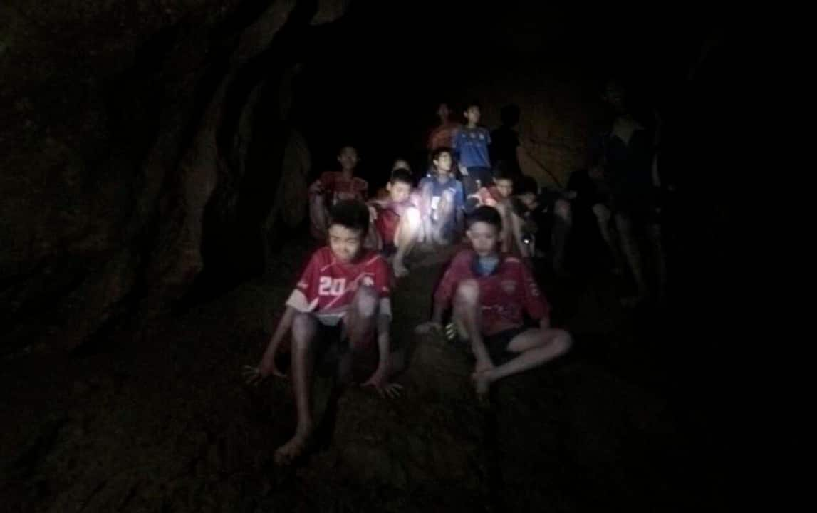 The boys and their soccer coach as they were found in a partially flooded cave.