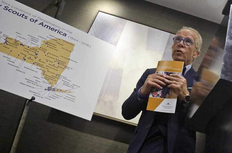 Attorney Jeff Anderson holds a list of names of more than 130 Boy Scout leaders who worked in New York and have been accused of offences.