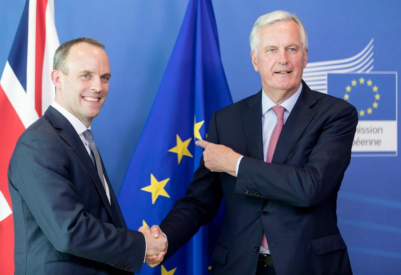 Brexit Secretary Dominic Raab (L) is welcomed by Michel Barnier.