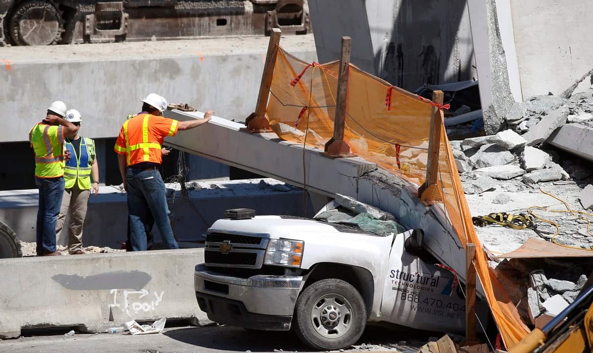 Authorities say the pedestrian bridge that failed had been put to a "stress test" and its cables were being tightened when it collapsed.