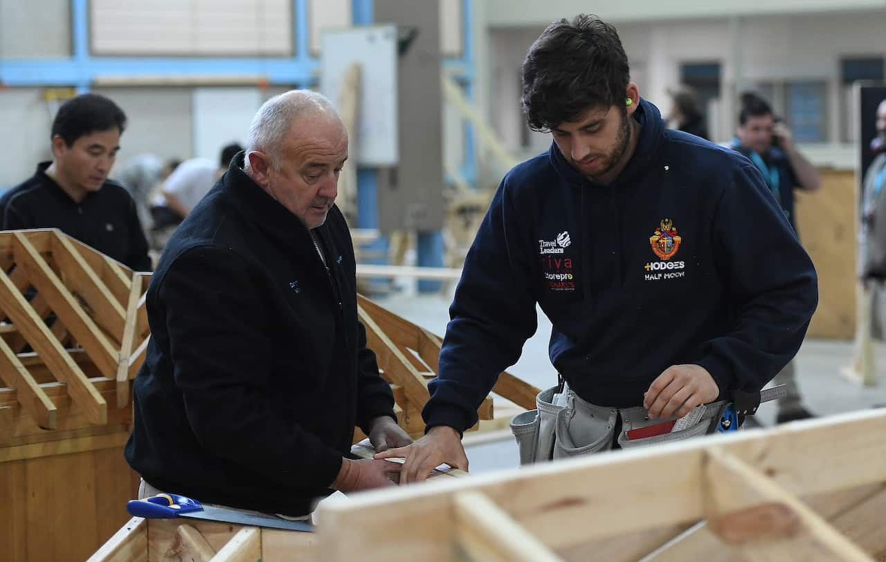 A master and apprentice carpenter at Holmesglen TAFE Chadstone campus in Melbourne. Tradies are set for a boost.