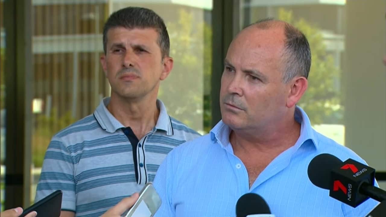 A spokesman from Icon answers questions from residents and journalists. 