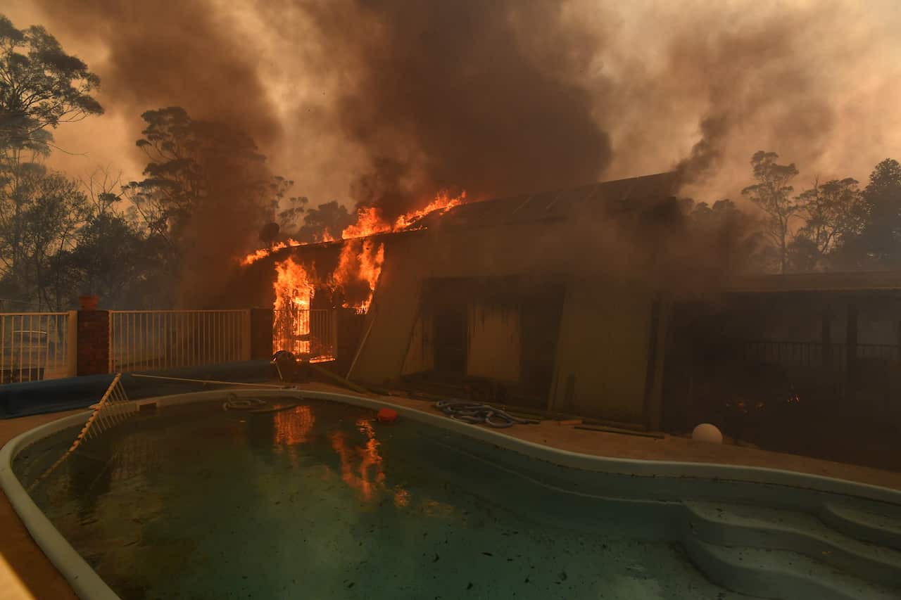 A home lost to a bushfire on Hassall Road in Buxton. Firefighters estimated 20 homes have been destroyed in the region.