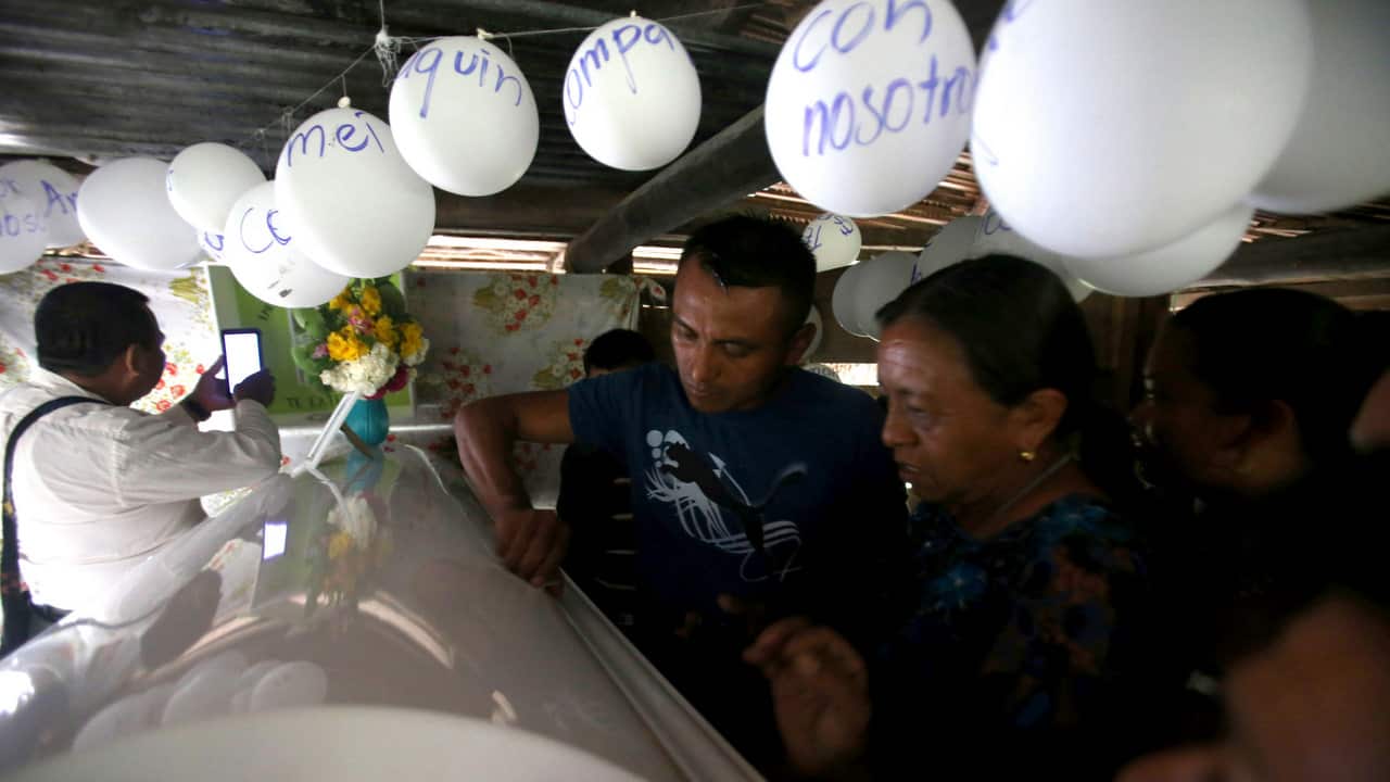 Neighbors and relatives attend the wake of Jakelin Caal.