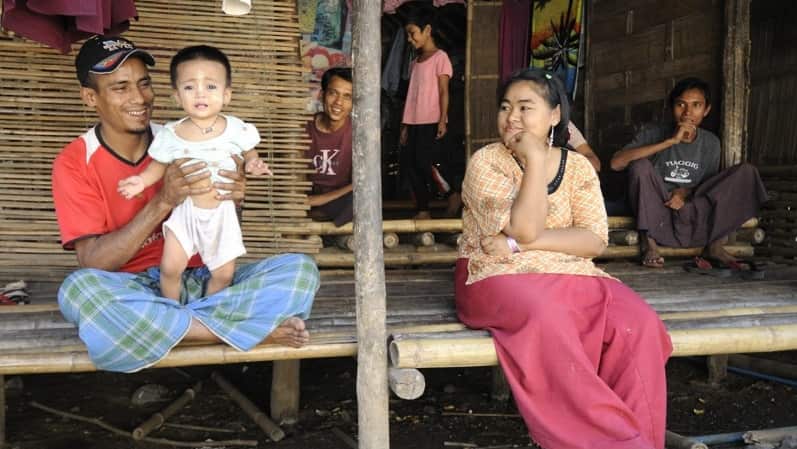 A family resting on their terrace in Mae La Camp.