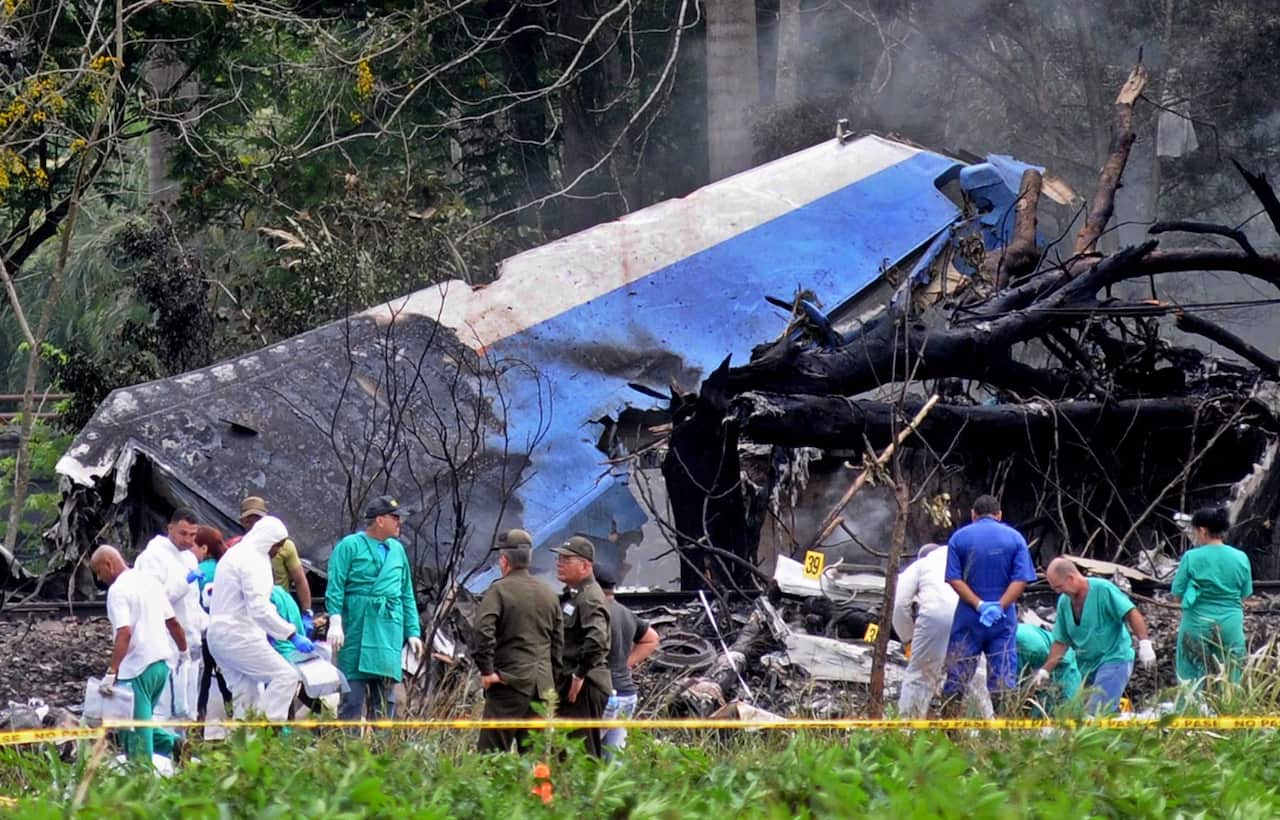Police and military personnel work among the wreckage of the Boeing-737 plane that crashed shortly after taking off from the Jose Marti airport in Havana