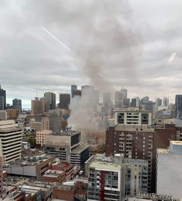 Smoke billowing from a Melbourne building after it caught fire late this morning. 
