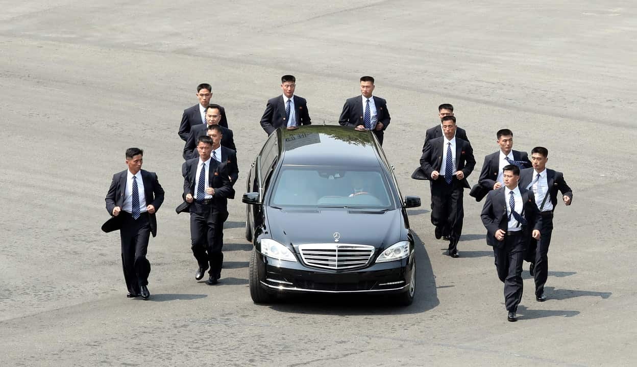Security officers surround Kim Jong-un's car as he heads to lunch after his meeting with South Korean President Moon Jae-in.