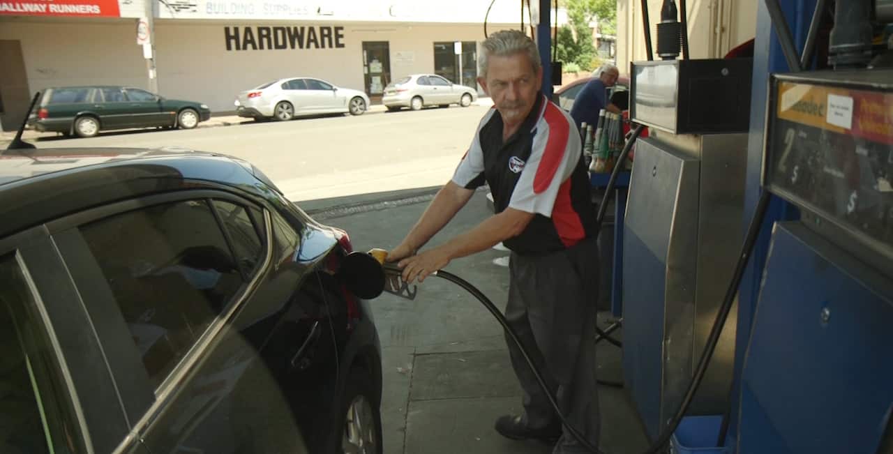 Del Carayannis fills up a customers car.