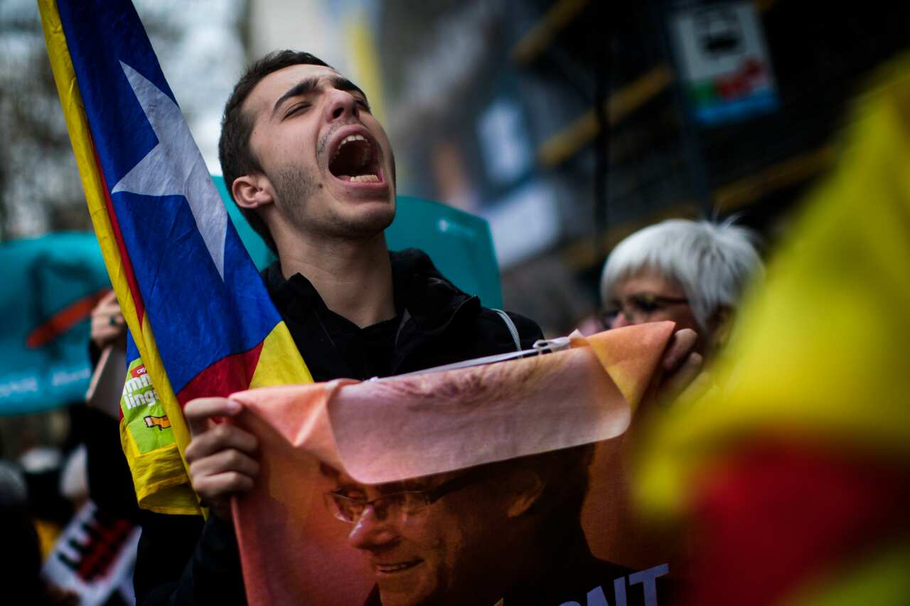 A protester chants as thousands of pro-independence supporters rally against the arrest of Carles Puigdemont.