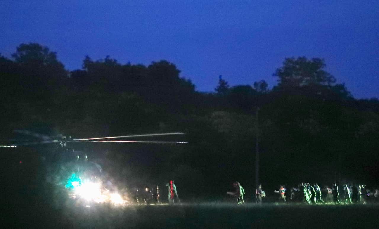 The first four boys are rushed to hospital after their ordeal.