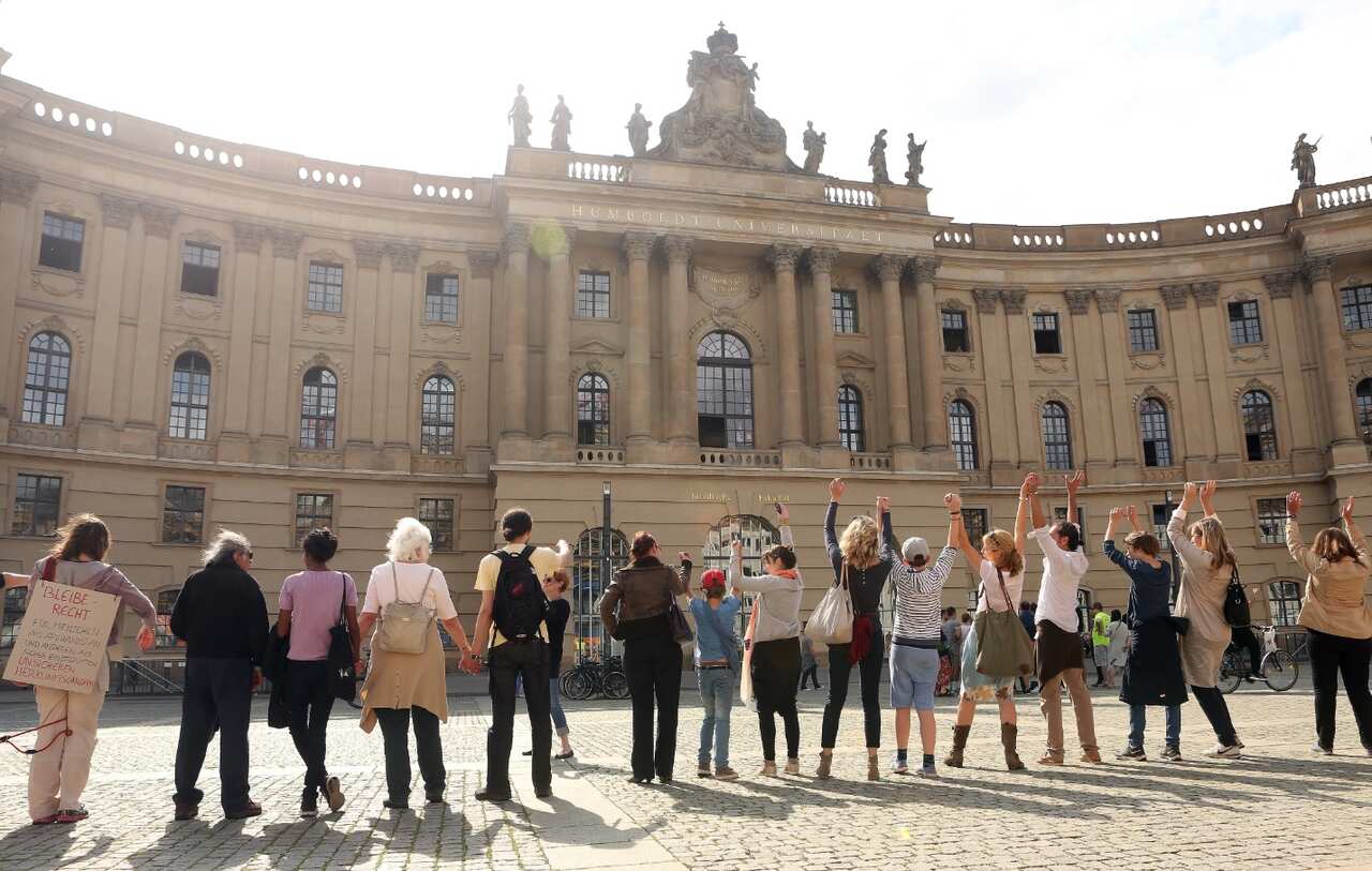 Participants form a human chain in a demonstration calling for tolerance of minorities and discouraging racism, on June 19, 2016 (Getty)