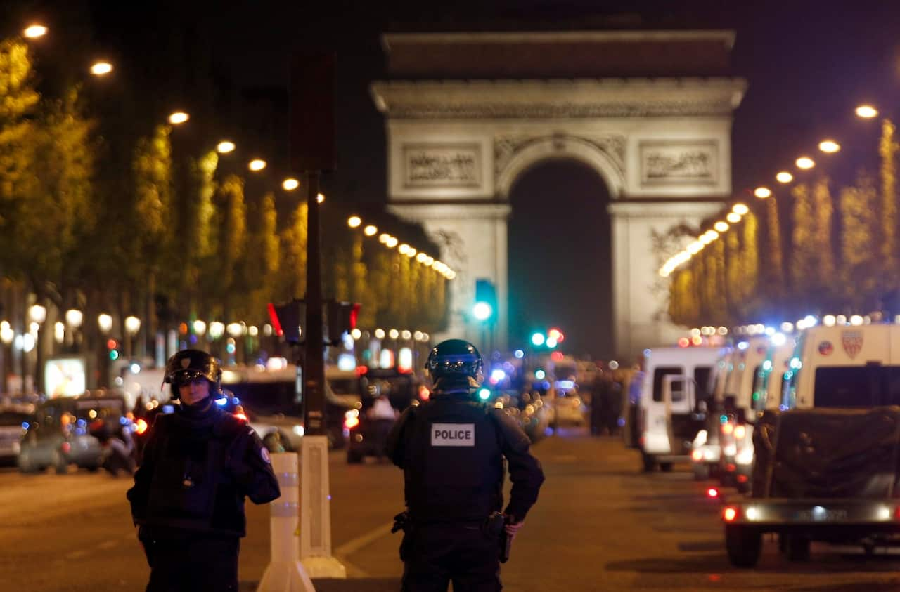 Police seal off the Champs Elysees avenue in Paris, France, after a fatal shooting in which a police officer was killed along with an attacker (AAP)