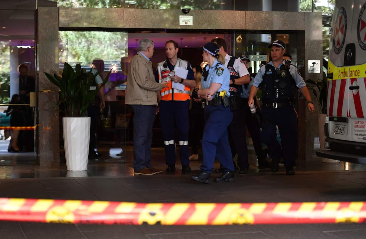 Emergency service workers at the scene of a chemical leak at the Pullman Hotel in Sydney, Wednesday, September 19, 2018. 