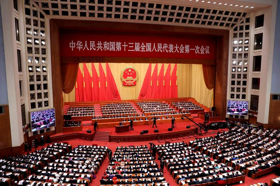 Deputies attend the opening meeting for the First Session of the 13th National People's Congress (NPC) at the Great Hall of the People in Beijing, China.