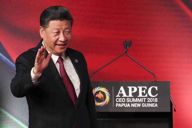 China's President Xi Jinping arrives for the APEC CEO Summit. He had strong words for the US.