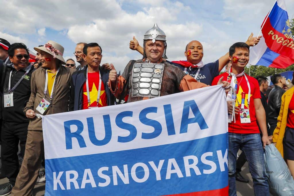 Fan of Russia with fans of China during the 2018 FIFA World Cup Russia group A match between Russia and Saudi Arabia at the Luzhniki Stadium on June 14, 2018