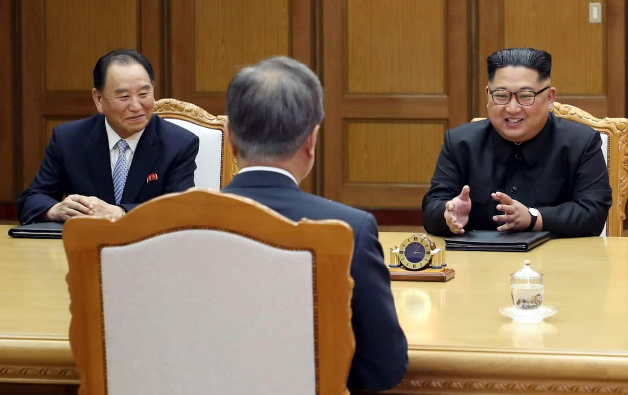 Kim Yong Chol (L) is seen with North korean leader Kim Jong-un during the meeting with South Korea