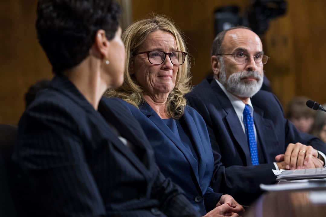 Christine Blasey Ford, centre, flanked by attorneys Debra Katz and Michael Bromwich, testifies during the Senate Judiciary Committee hearing.