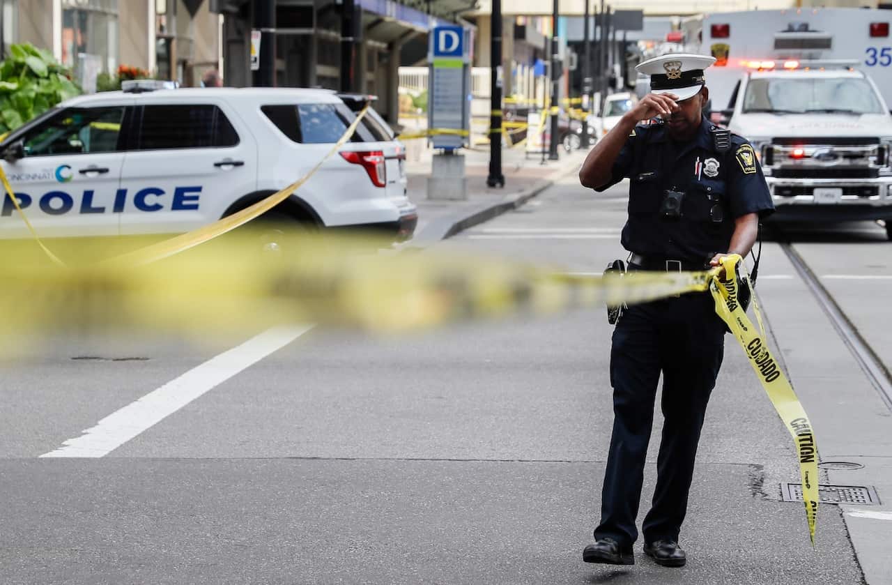Emergency personnel and police work the scene of shooting near Fountain Square, Thursday, Sept. 6, 2018, in downtown Cincinnati.
