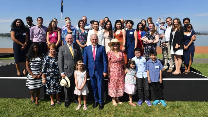 Prime Minister Malcolm Turnbull and Governor-General Peter Cosgrove with new Australian citizens after a Citizenship Ceremony on January 26, 2018.