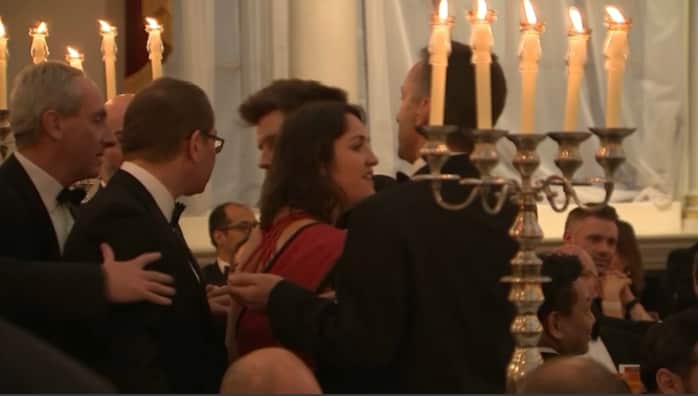 The Greecepeace protesters were removed from the official event after several minutes.