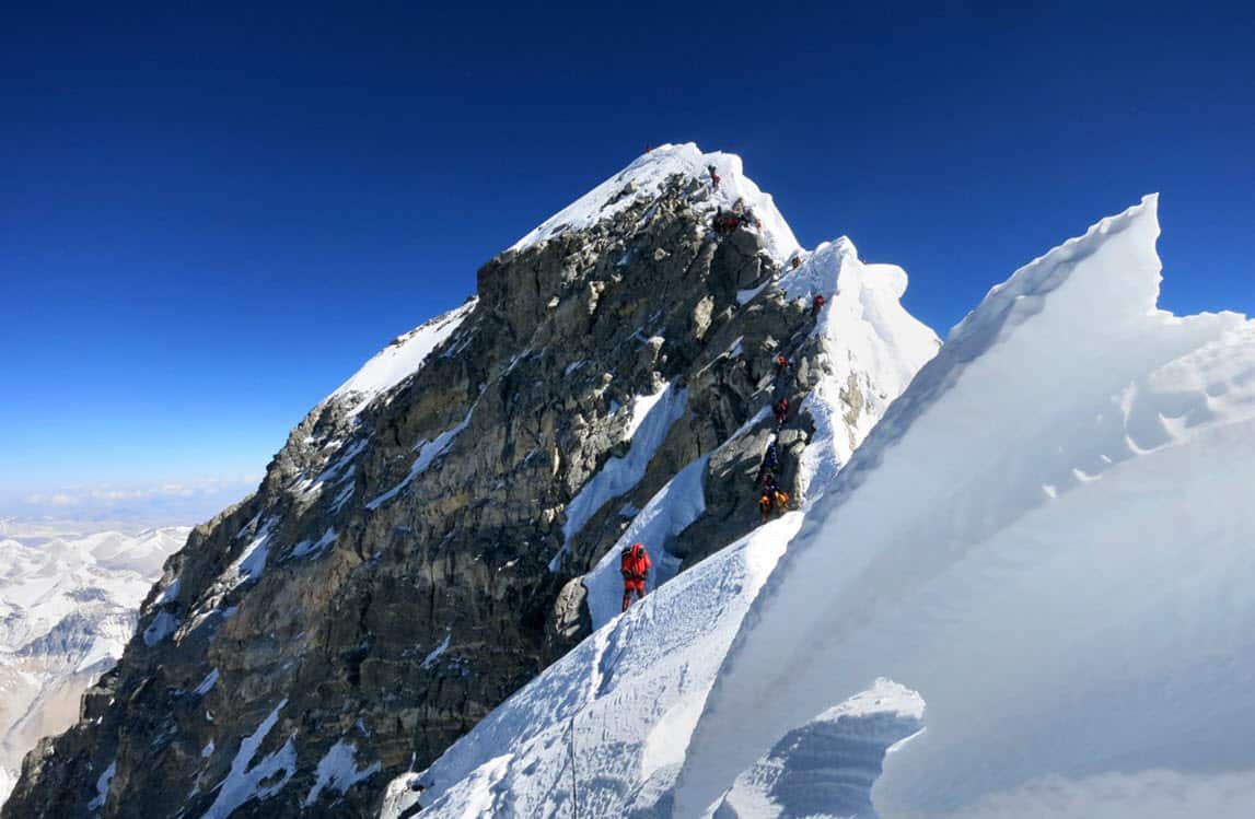 Climbers navigate the knife-edge ridge just below the Hillary Step on their way to the summit of Mount Everest (AAP)