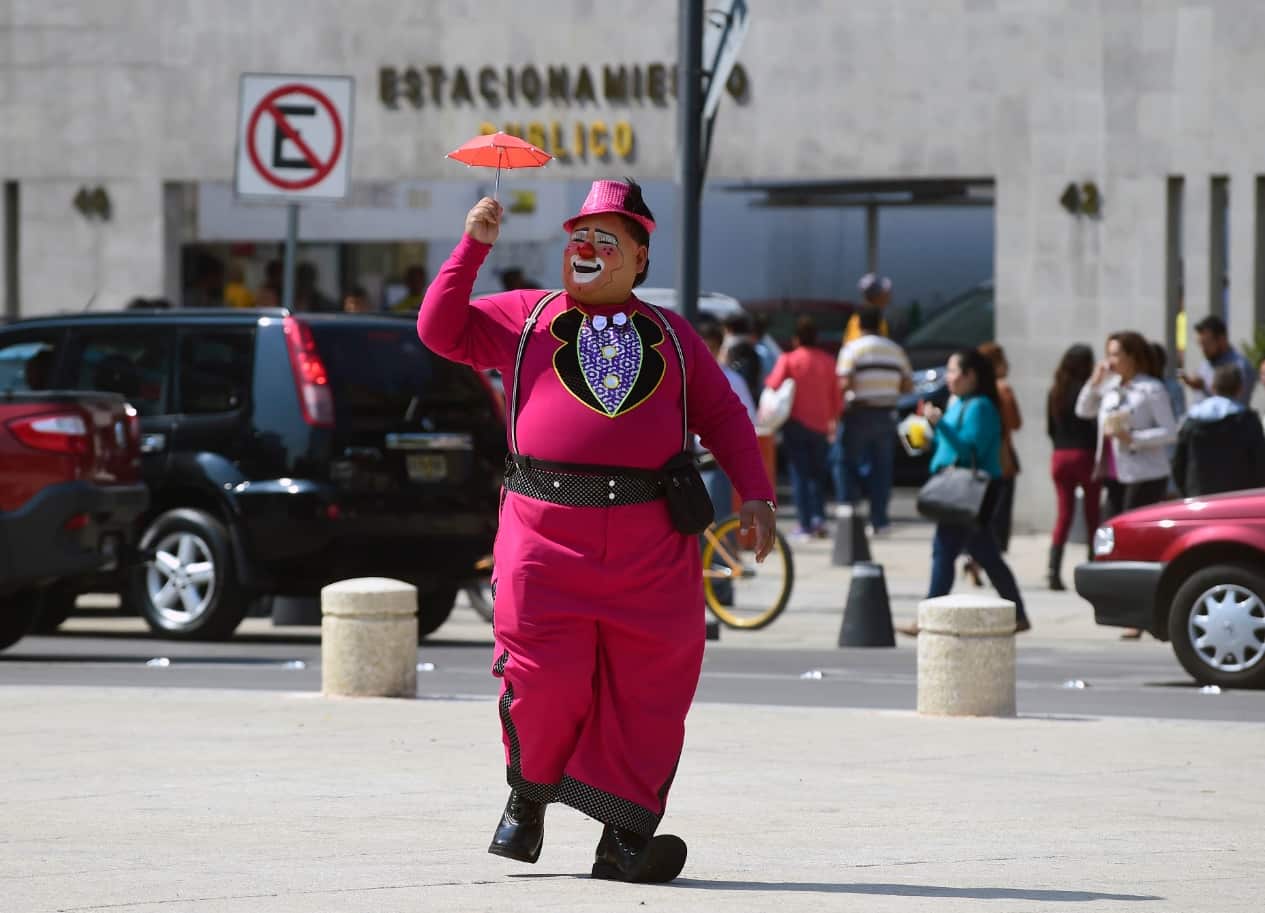 A clown walks during the third day of the XXI Convention of Clowns, at the Jimenez Rueda Theatre, in Mexico City on October 19, 2016. (Getty)